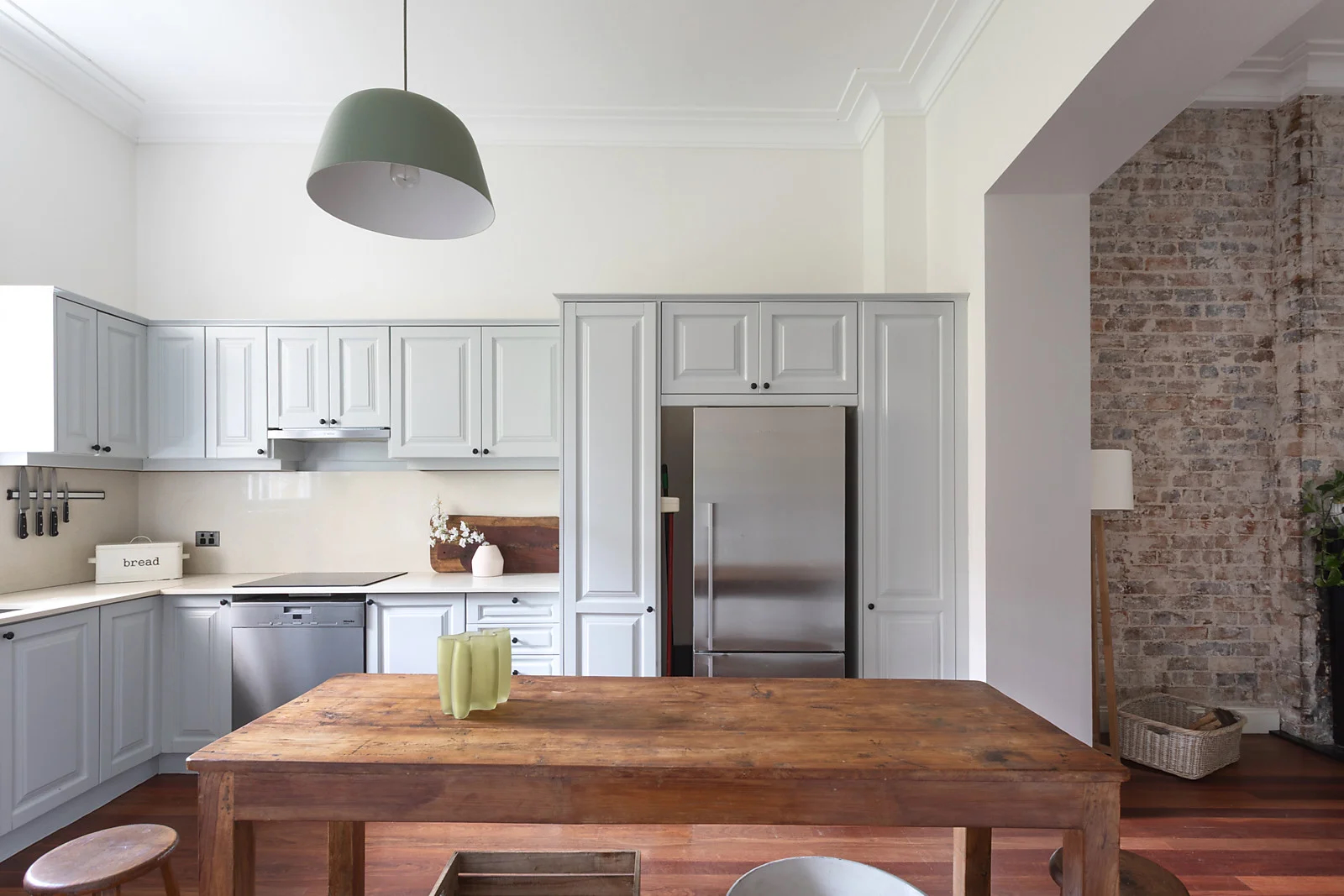 Painted kitchen cabinets with brick arch